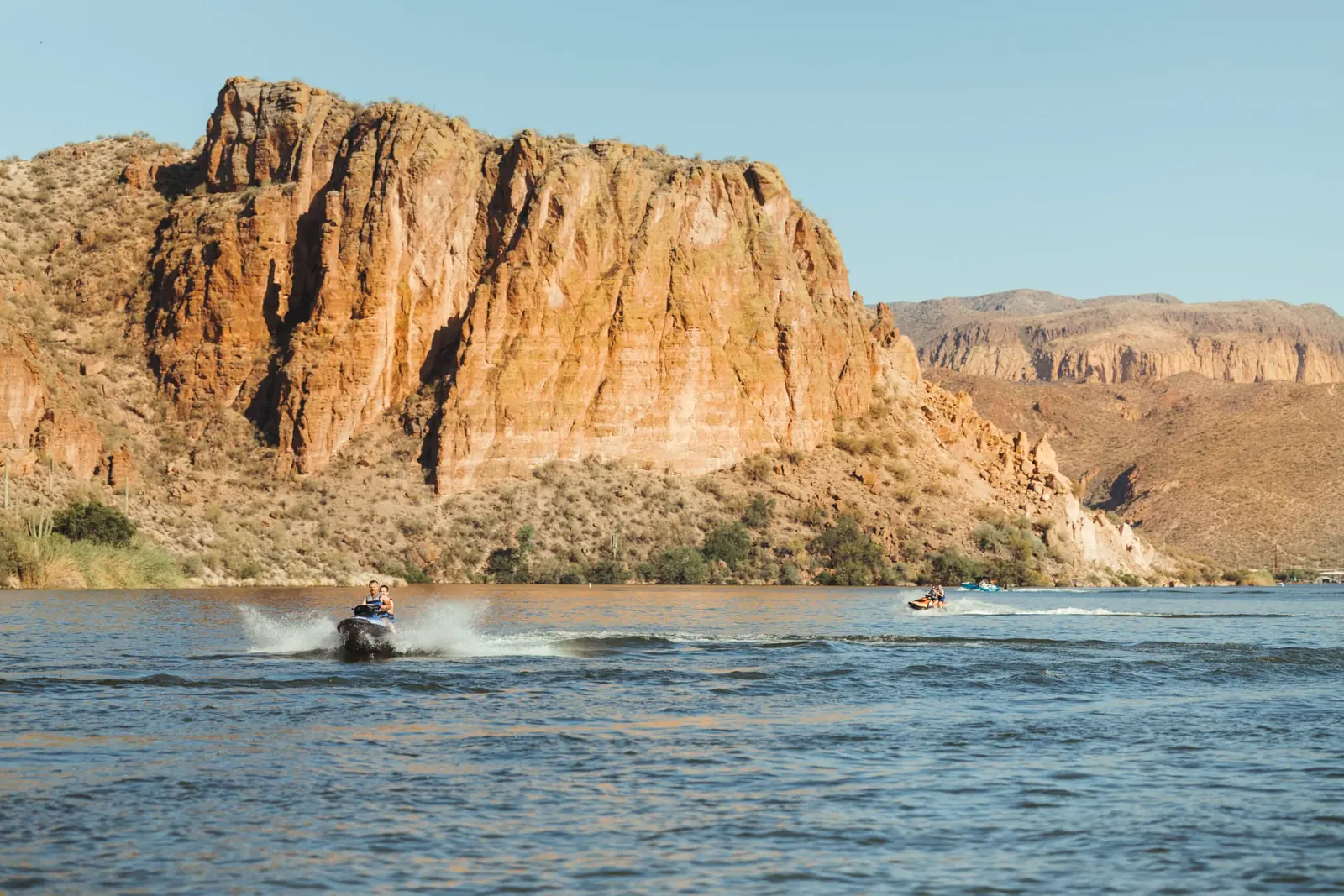 Red rock canyon walls rising from an Arizona lake